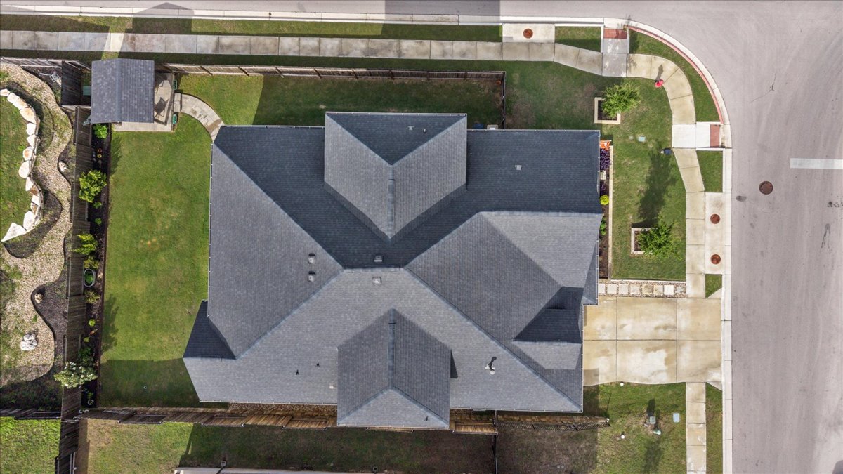 1029 Wild Pecan Loop Buda, TX 78610 - Photo 33 of 37 an aerial view of a house with a swimming pool