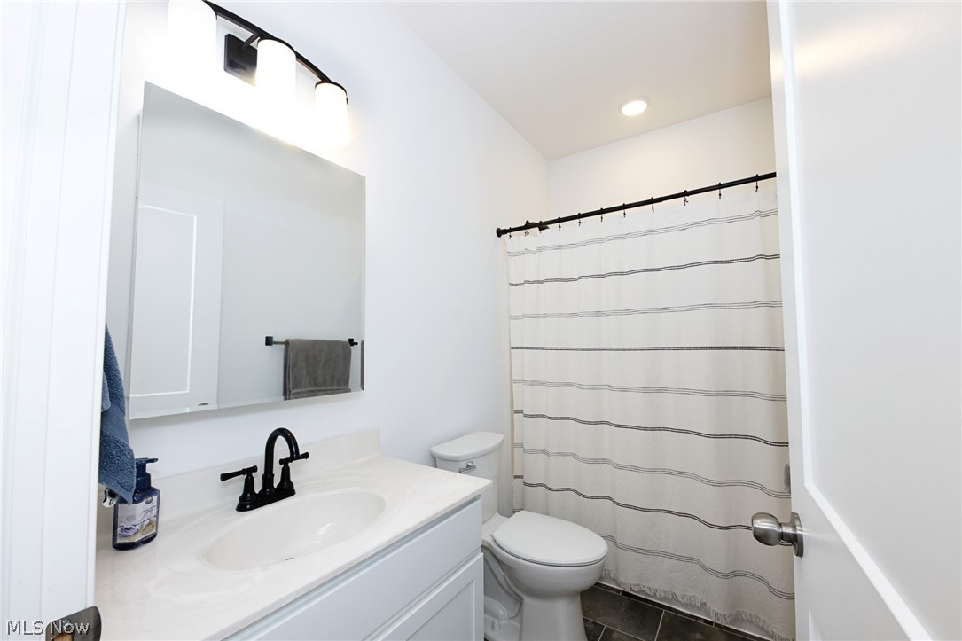258 Friendly Acres Road Wellsburg, WV 26070 - Photo 22 of 47 Bathroom with vanity, a shower with curtain, and toilet