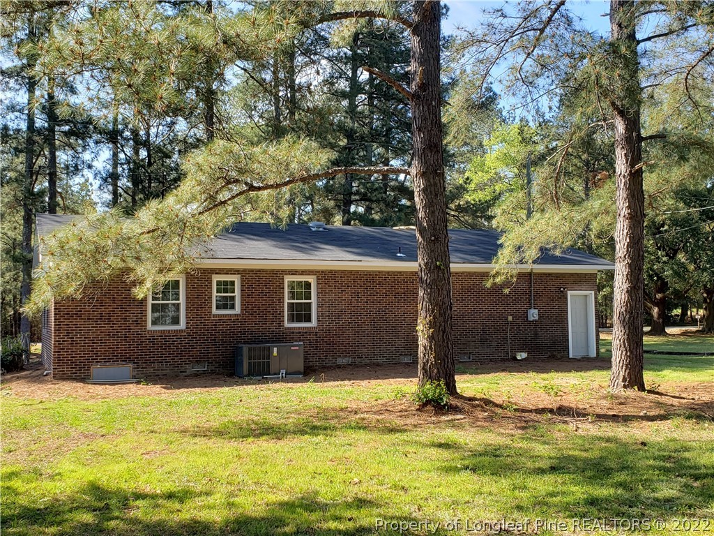 711 Reservation Road Aberdeen, NC 28315 - Photo 3 of 19 a view of a house with a yard