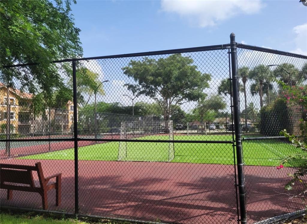 8741 Wiles Road, Unit 305 Coral Springs, FL 33067 - Photo 15 of 20 a view of a street with a big yard