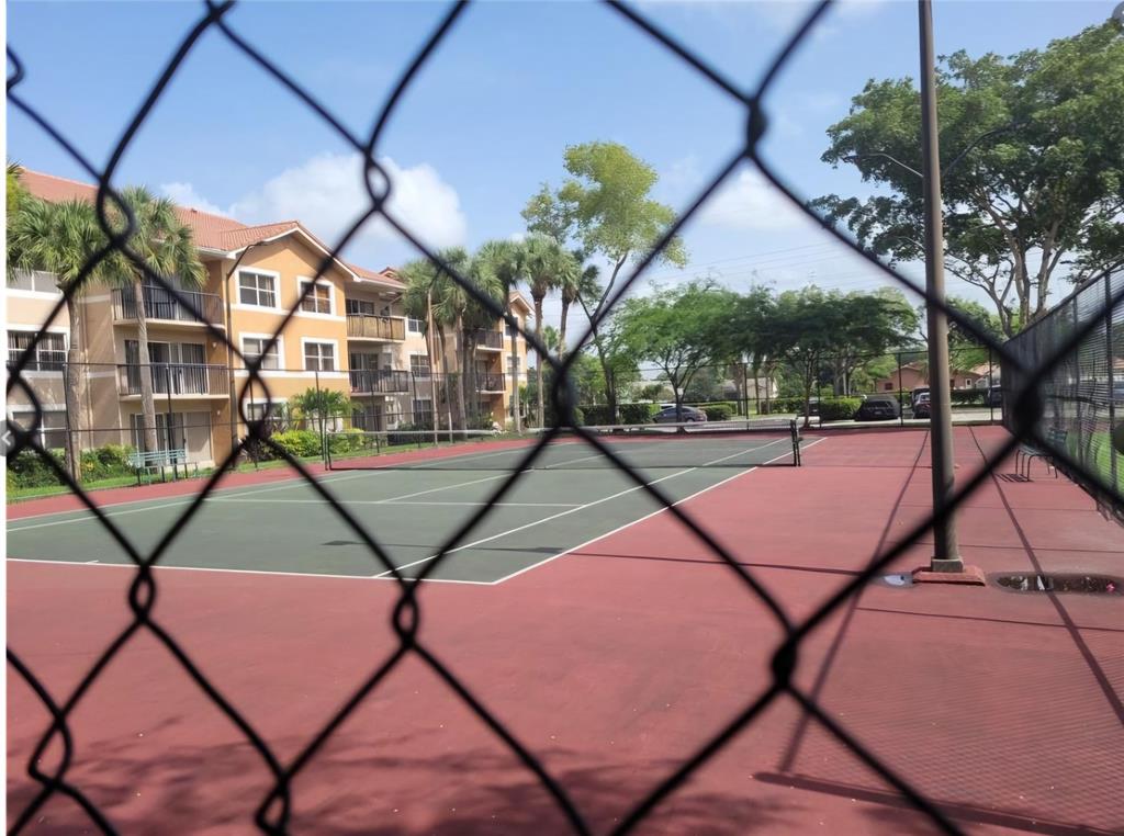 8741 Wiles Road, Unit 305 Coral Springs, FL 33067 - Photo 16 of 20 a view of a yard in a backyard