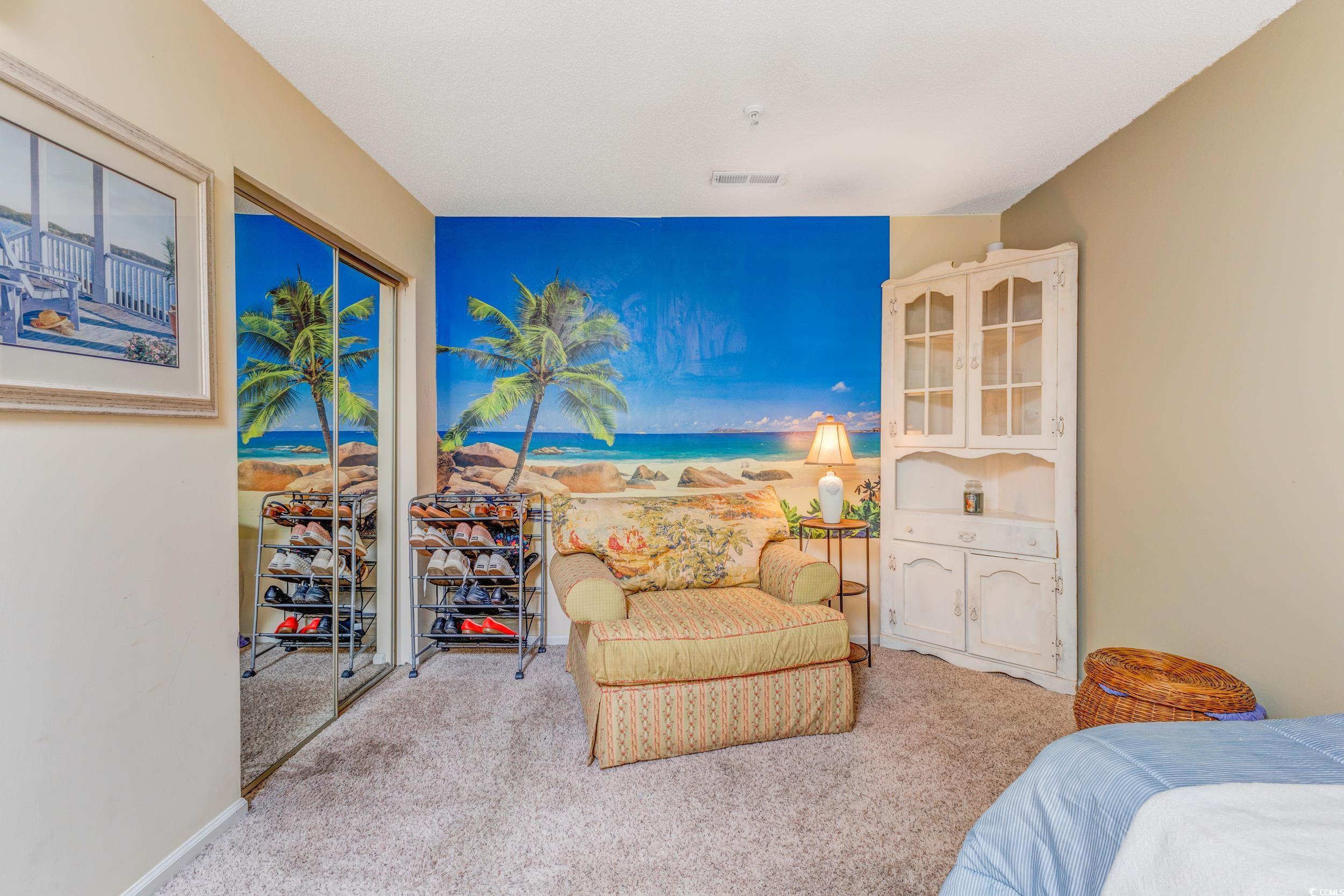 1100 Possum Trot Road, Unit G326 North Myrtle Beach, SC 29582 - Photo 11 of 21 Bedroom featuring light carpet and a closet