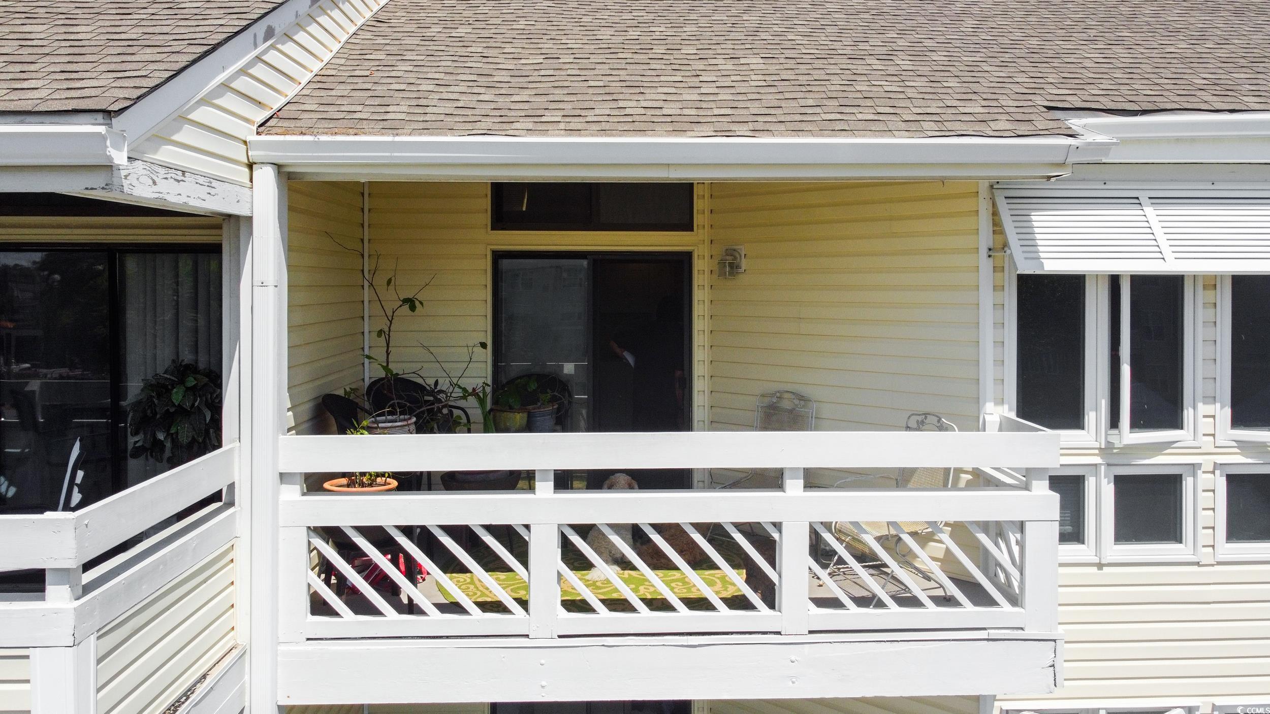 1100 Possum Trot Road, Unit G326 North Myrtle Beach, SC 29582 - Photo 18 of 21 View of exterior entry featuring roof with shingles