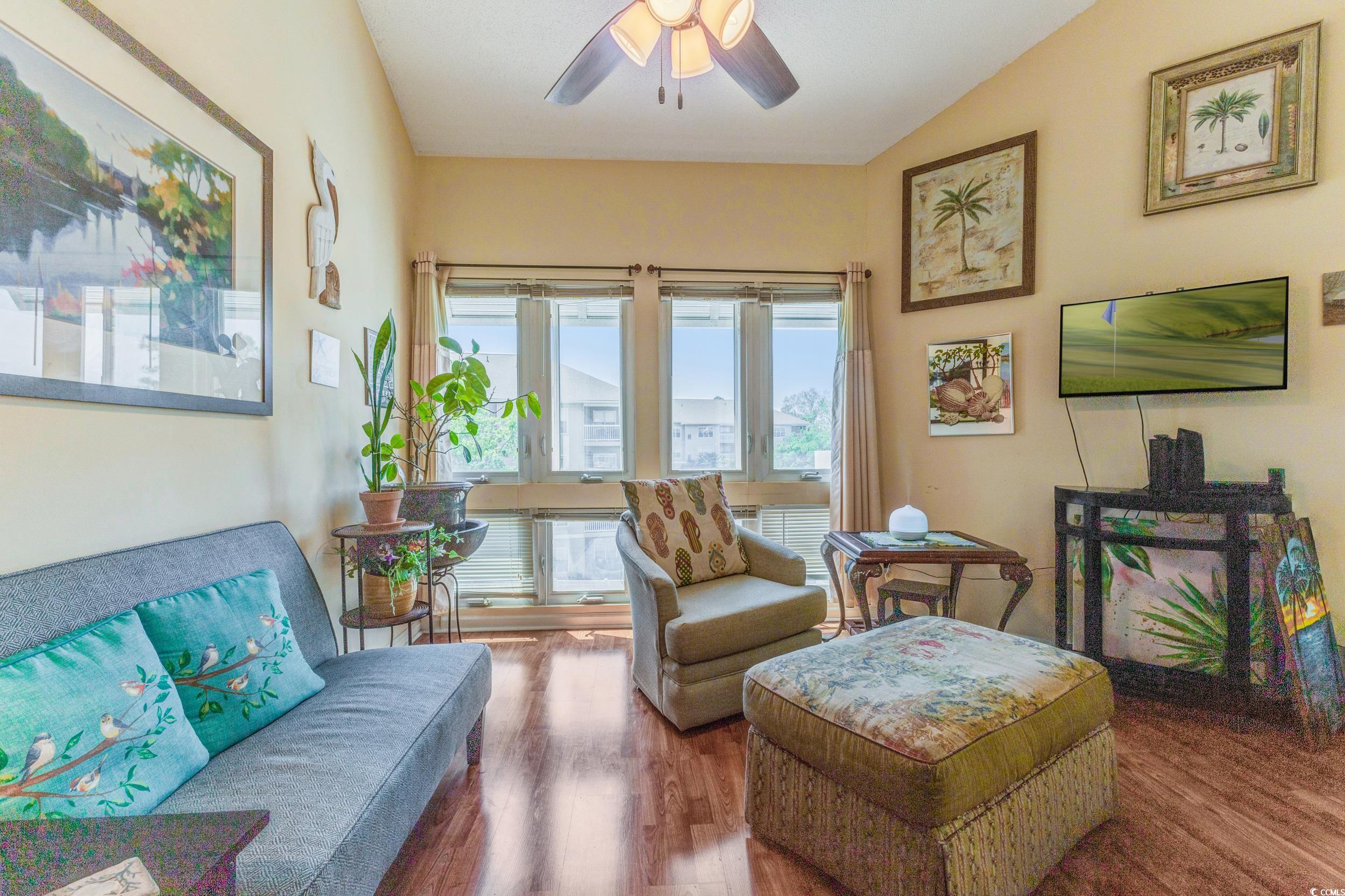 1100 Possum Trot Road, Unit G326 North Myrtle Beach, SC 29582 - Photo 6 of 21 Living area with wood finished floors and a ceiling fan