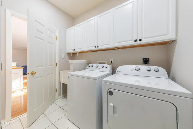 a view of storage and utility room with washer and dryer