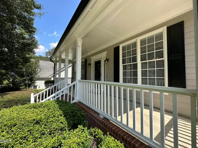a view of a house with a small yard
