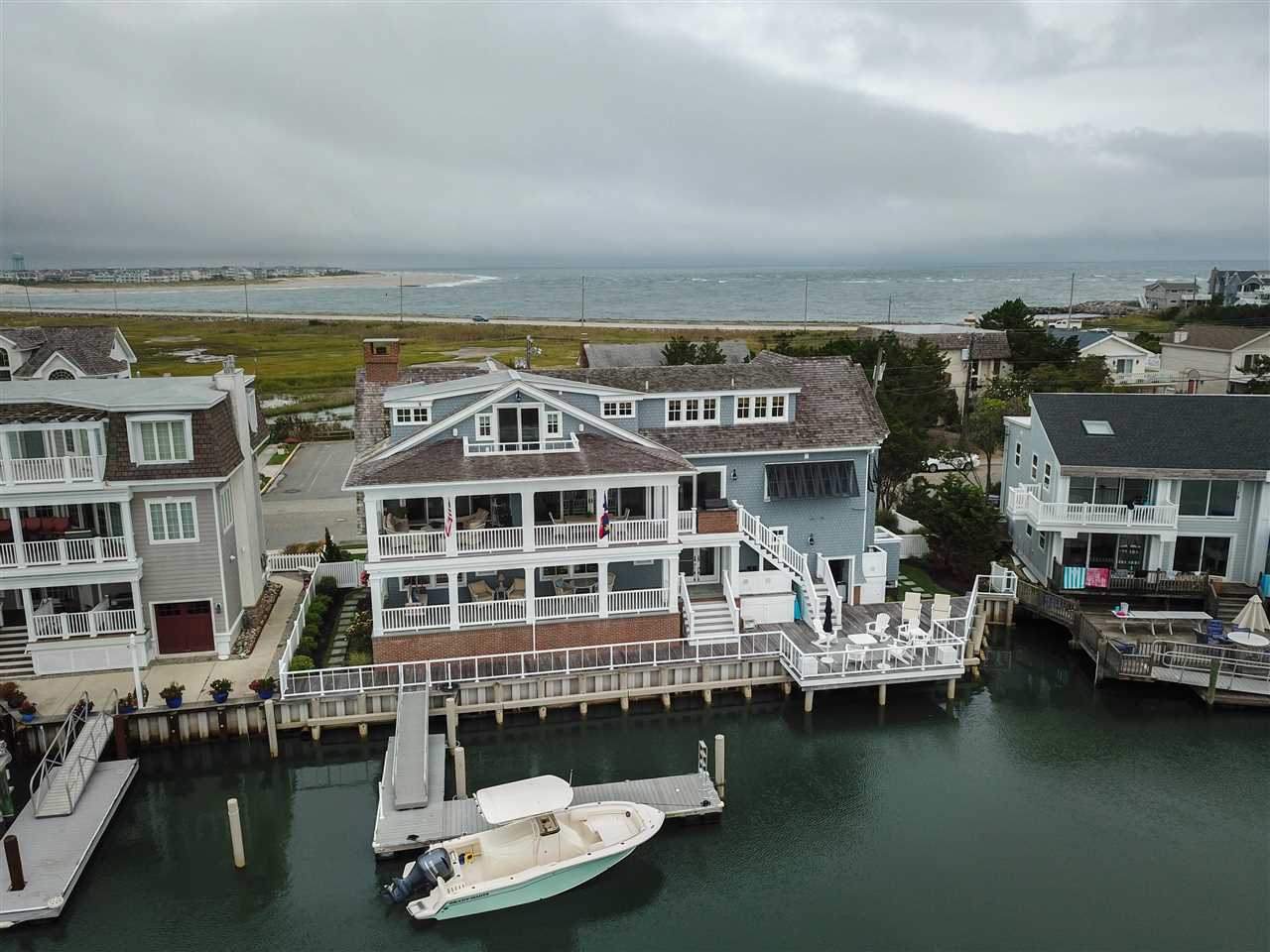 498 7th Street Avalon, NJ 08202 - Photo 2 of 36 a front view of a building with swimming pool