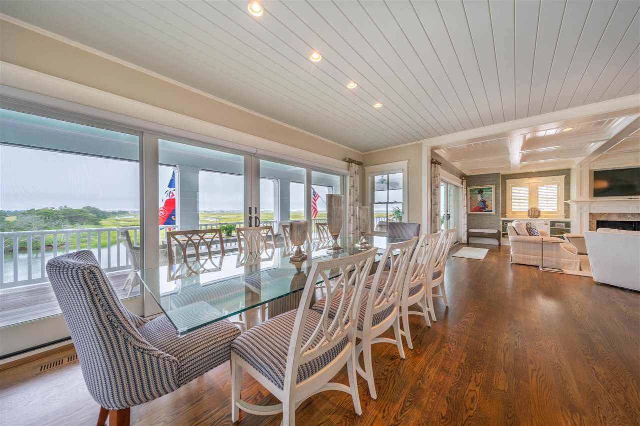 498 7th Street Avalon, NJ 08202 - Photo 11 of 36 a dining room with furniture water view and wooden floor