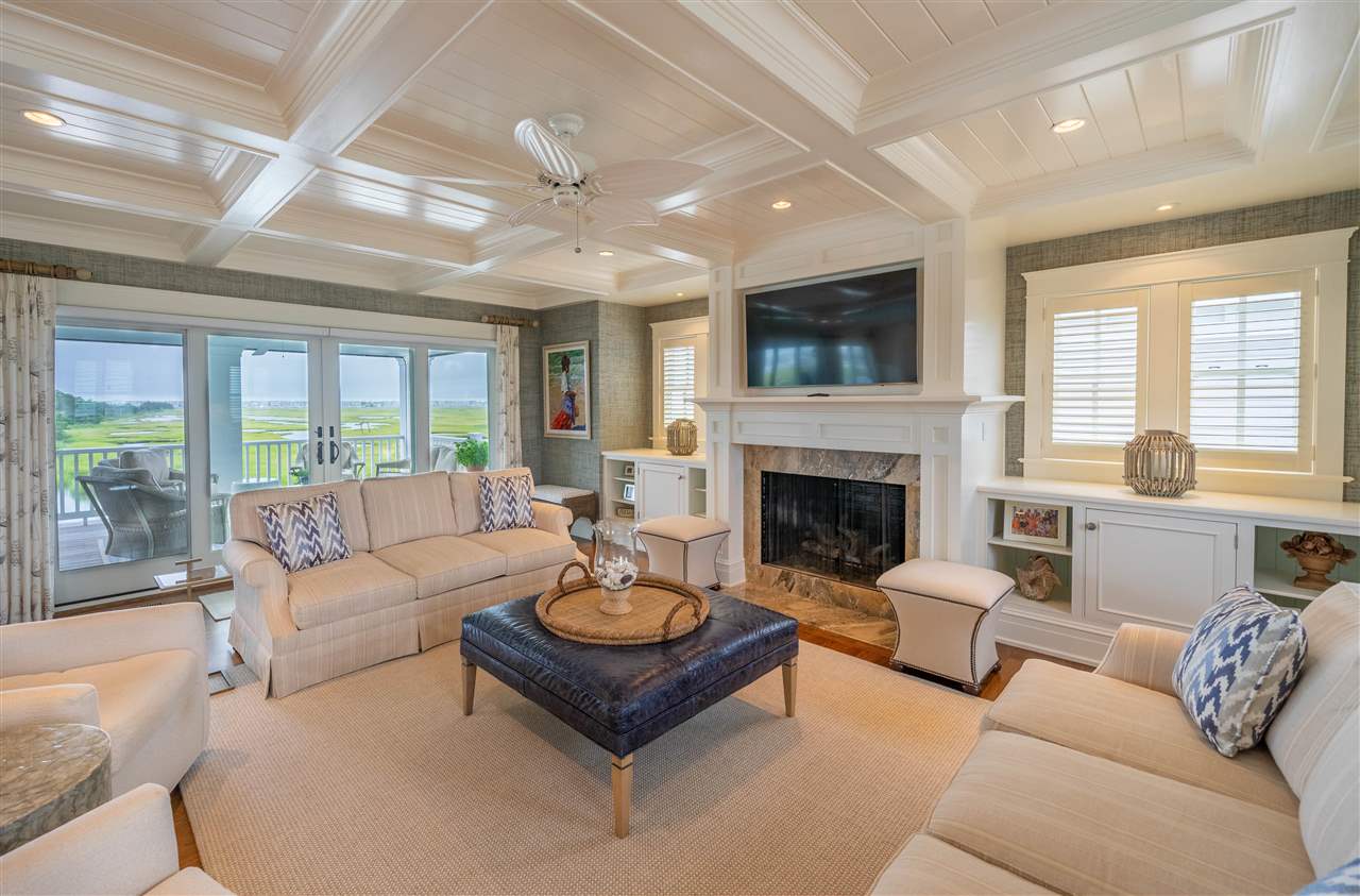 498 7th Street Avalon, NJ 08202 - Photo 12 of 36 a living room with furniture and a fireplace