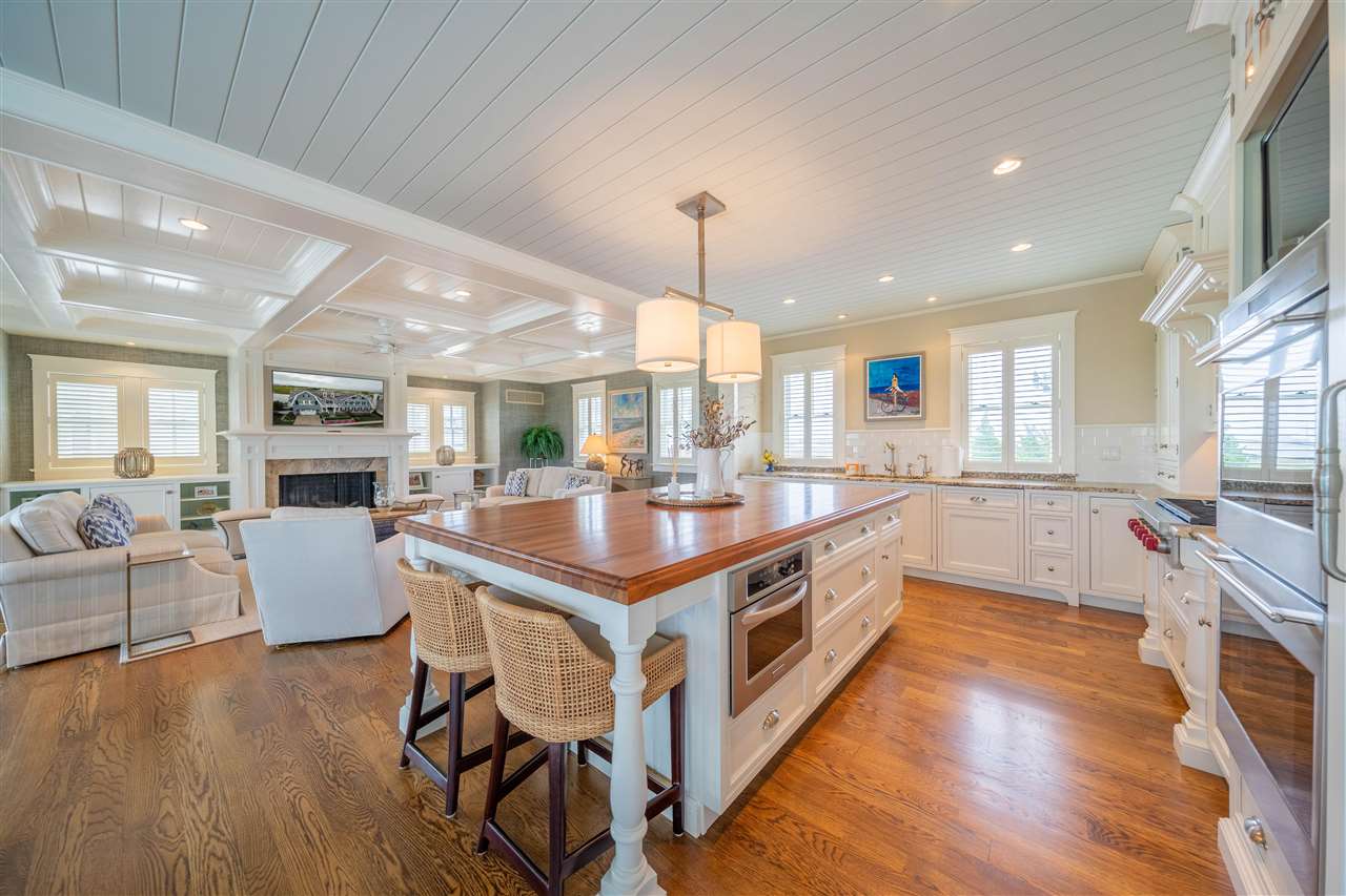 498 7th Street Avalon, NJ 08202 - Photo 15 of 36 a large kitchen with a table and chairs