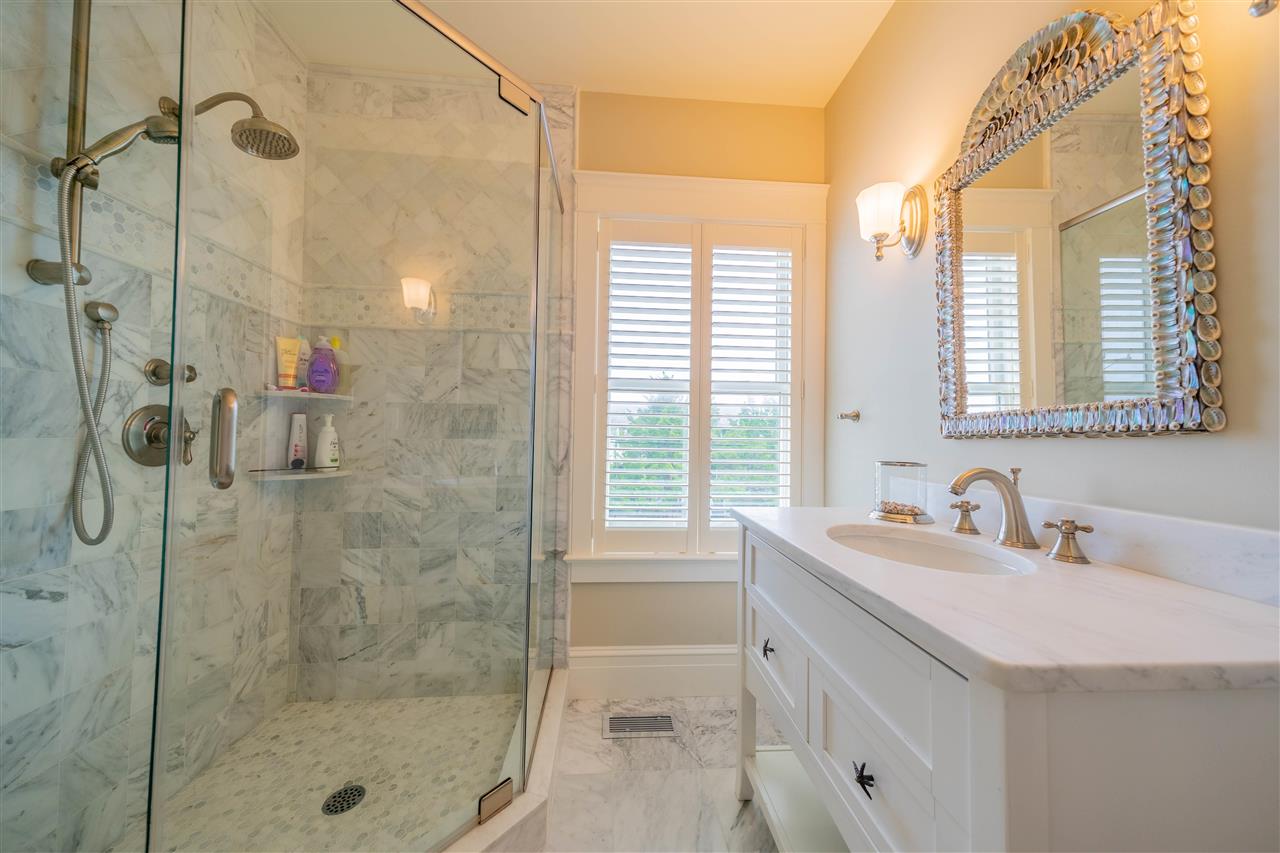 498 7th Street Avalon, NJ 08202 - Photo 18 of 36 a bathroom with a shower sink and mirror