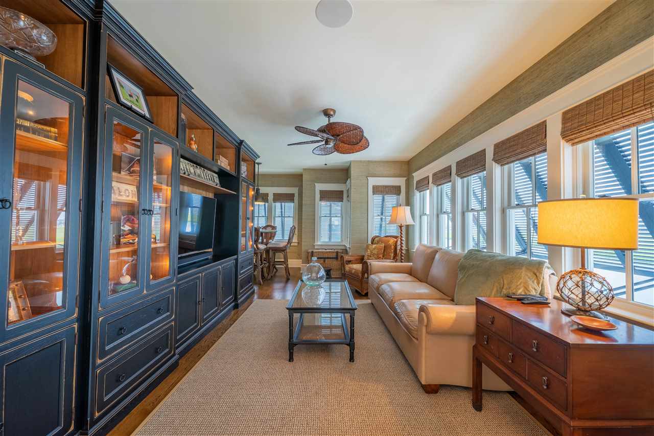 498 7th Street Avalon, NJ 08202 - Photo 20 of 36 a living room with furniture a flat screen tv and a window
