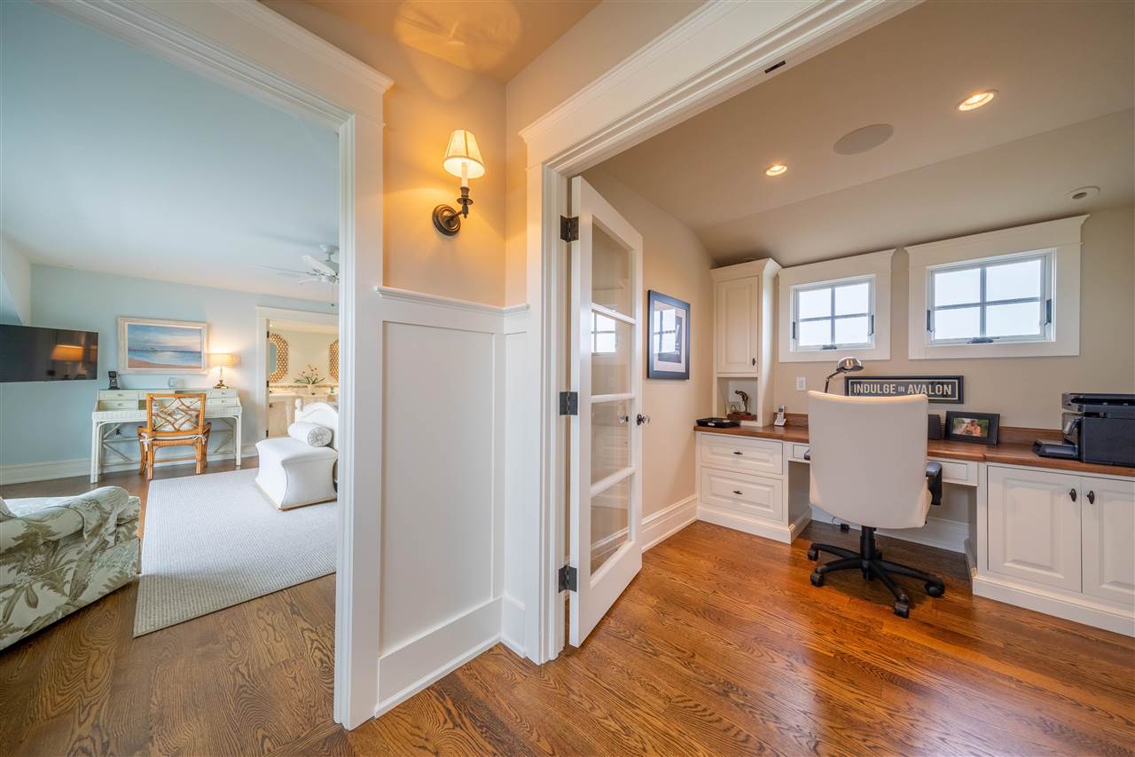498 7th Street Avalon, NJ 08202 - Photo 25 of 36 a view of a living room kitchen and a wooden floor