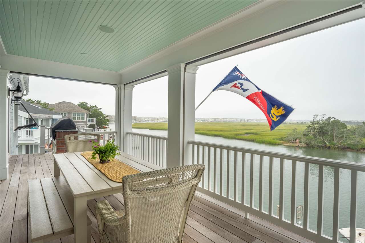 498 7th Street Avalon, NJ 08202 - Photo 29 of 36 a balcony with furniture and wooden floor