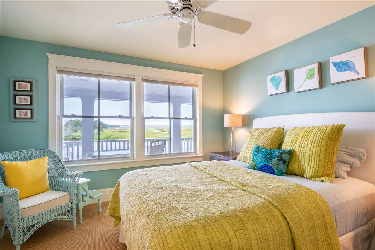 498 7th Street Avalon, NJ 08202 - Photo 4 of 36 a bedroom with a bed and a couch