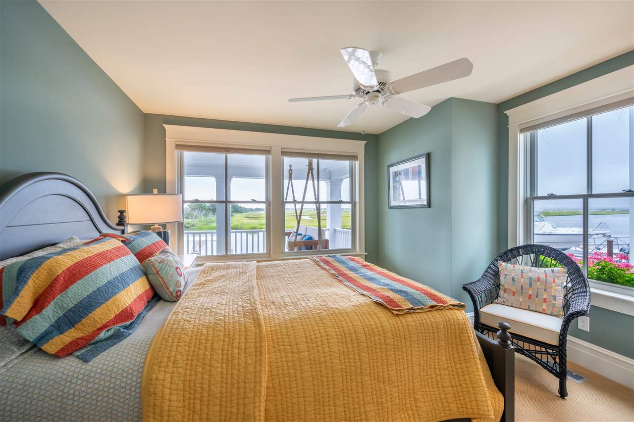 498 7th Street Avalon, NJ 08202 - Photo 5 of 36 a bedroom with a bed and a large window