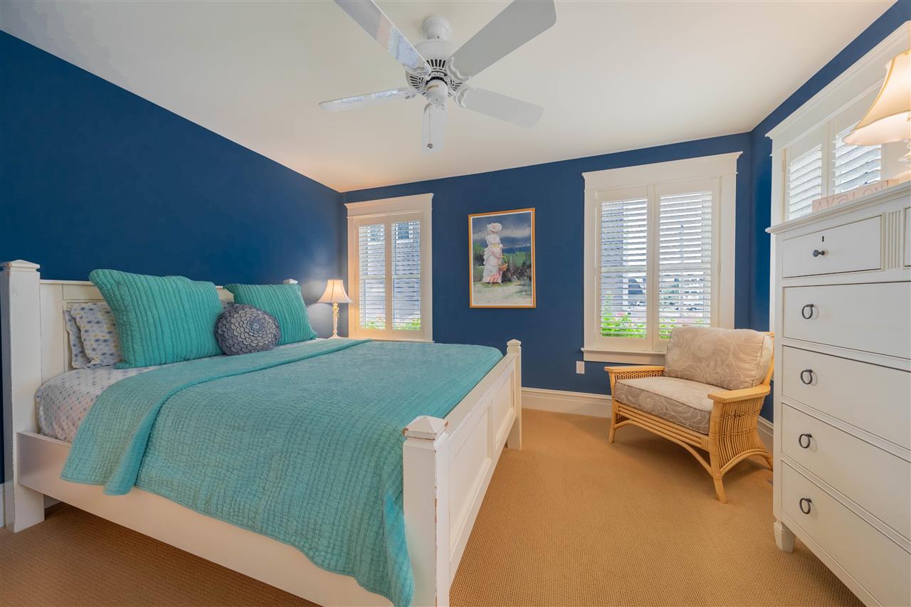 498 7th Street Avalon, NJ 08202 - Photo 8 of 36 a bedroom with a bed and a chandelier