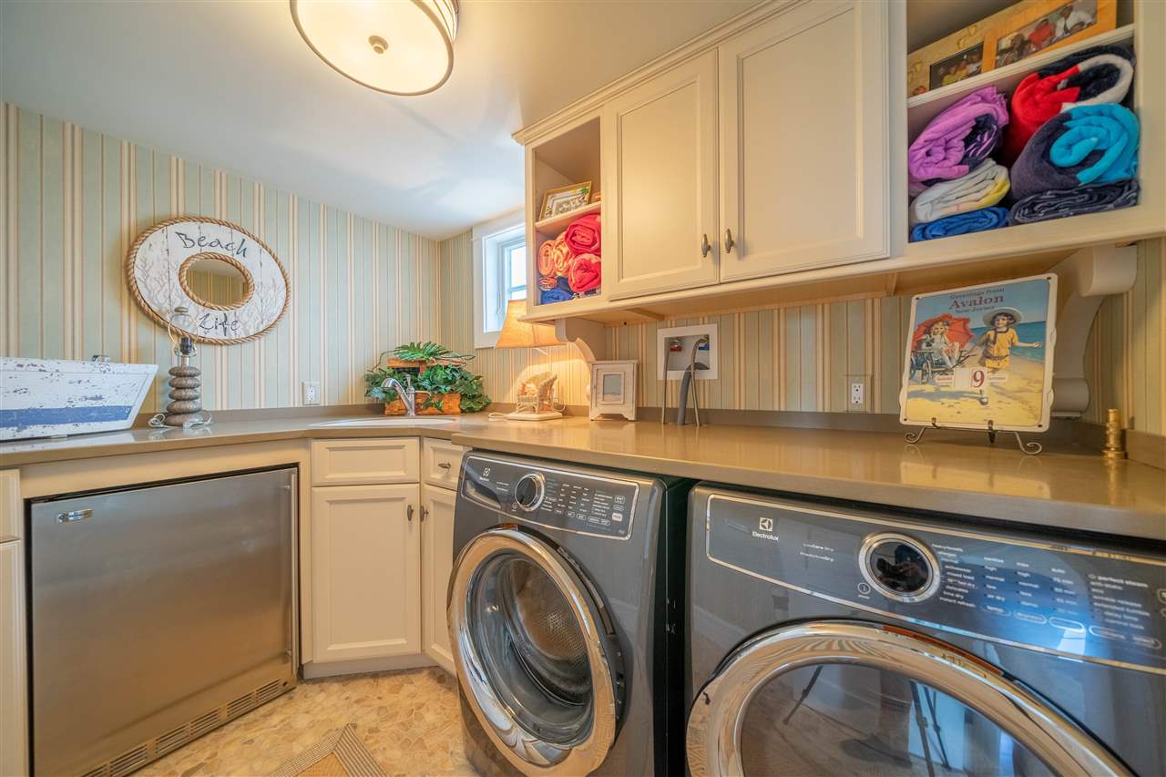 498 7th Street Avalon, NJ 08202 - Photo 10 of 36 a utility room with stainless steel appliances and cabinets
