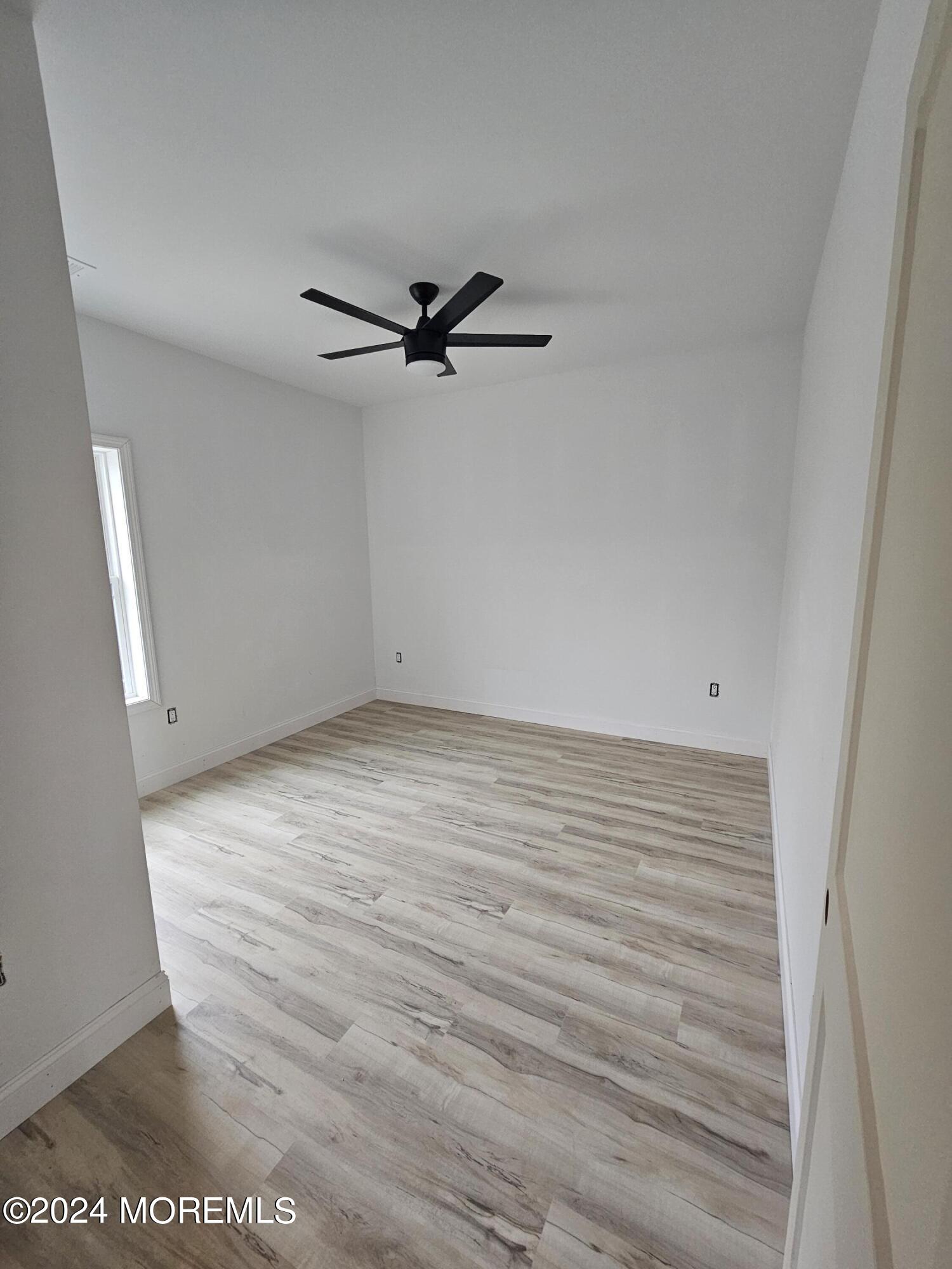 91 Illinois Avenue Waretown, NJ 08758 - Photo 10 of 12 a view of an empty room