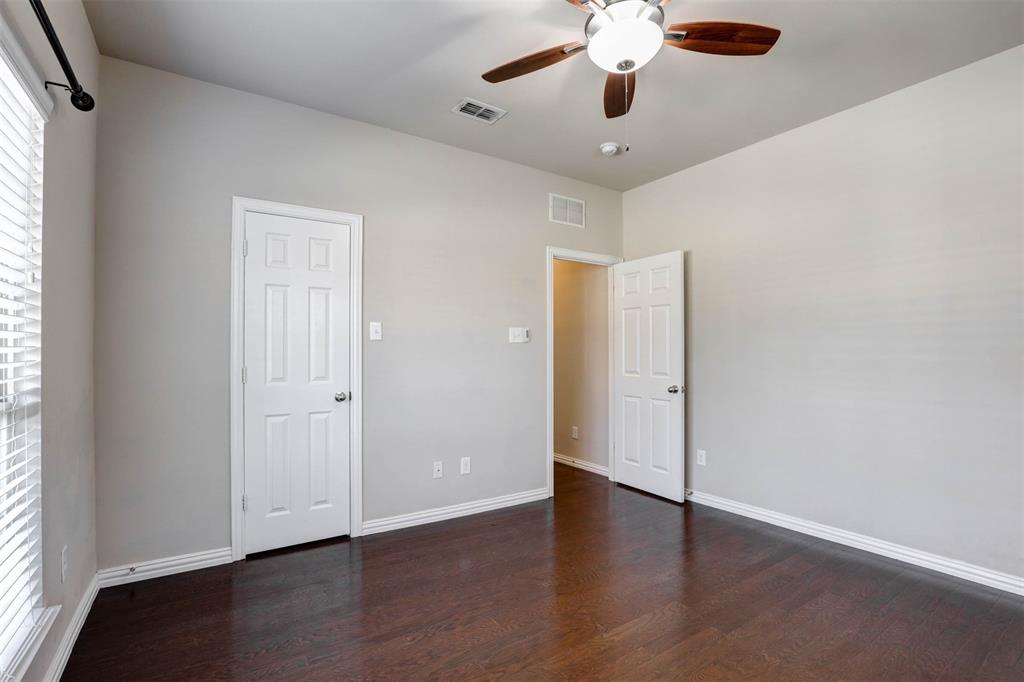5633 Hummingbird Lane Fairview, TX 75069 - Photo 21 of 25 a view of an empty room with wooden floor and a window