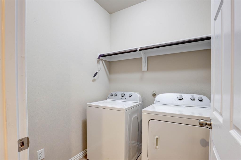 5633 Hummingbird Lane Fairview, TX 75069 - Photo 24 of 25 a utility room with dryer and washer