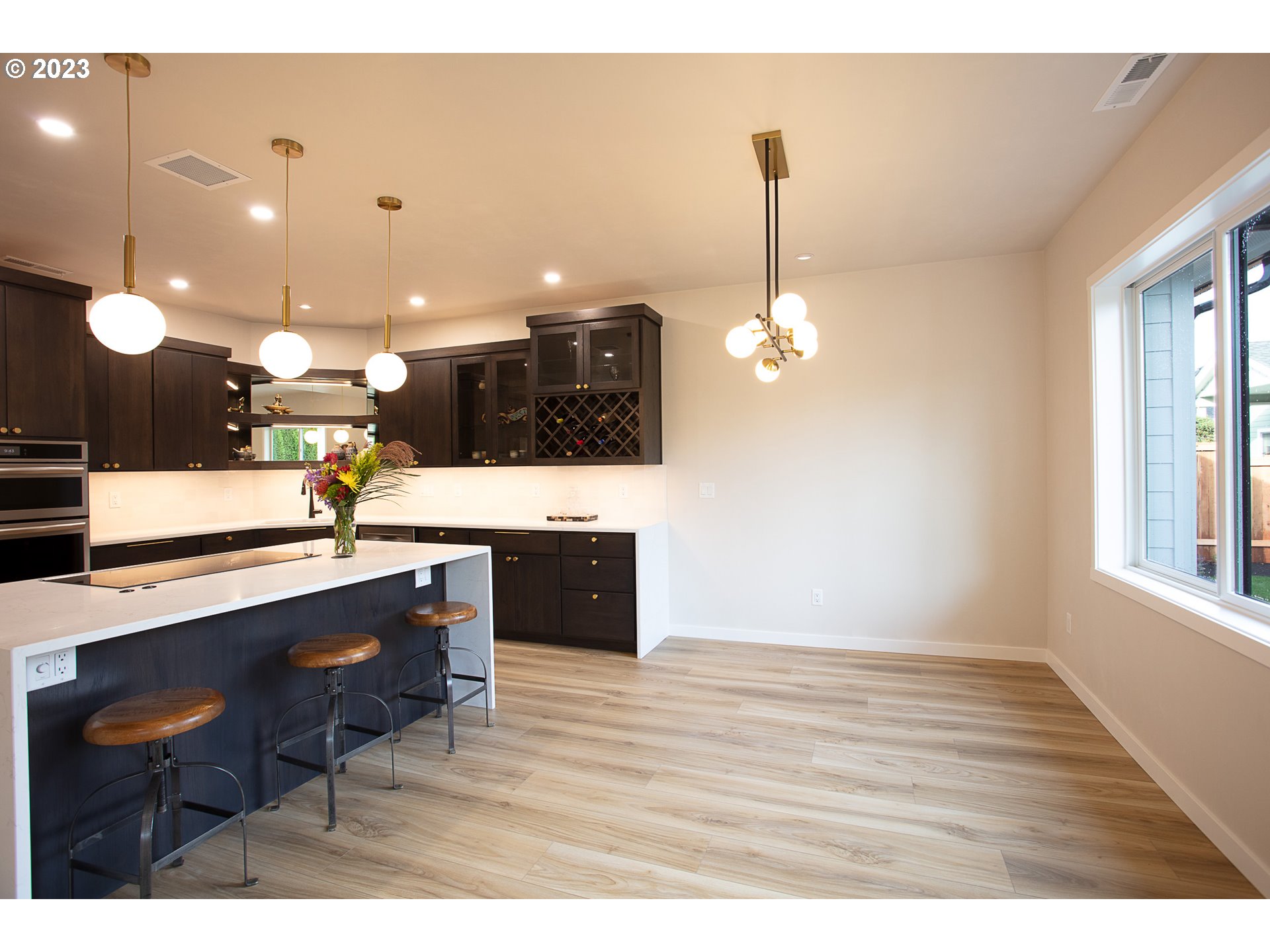 806 Salmonberry Street Springfield, OR 97477 - Photo 14 of 31 a kitchen with a sink and chandelier