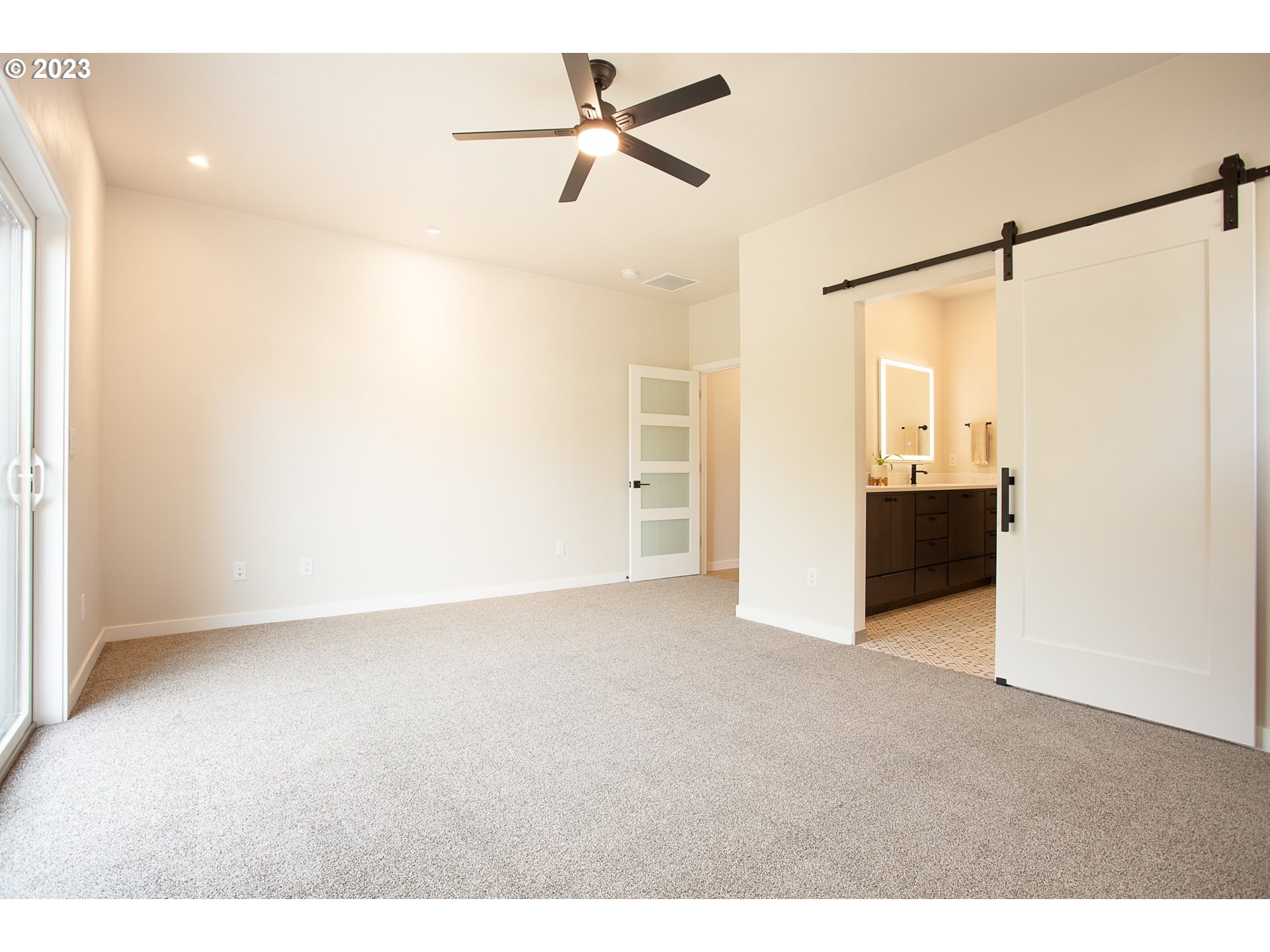 806 Salmonberry Street Springfield, OR 97477 - Photo 20 of 31 a view of a big room with carpet