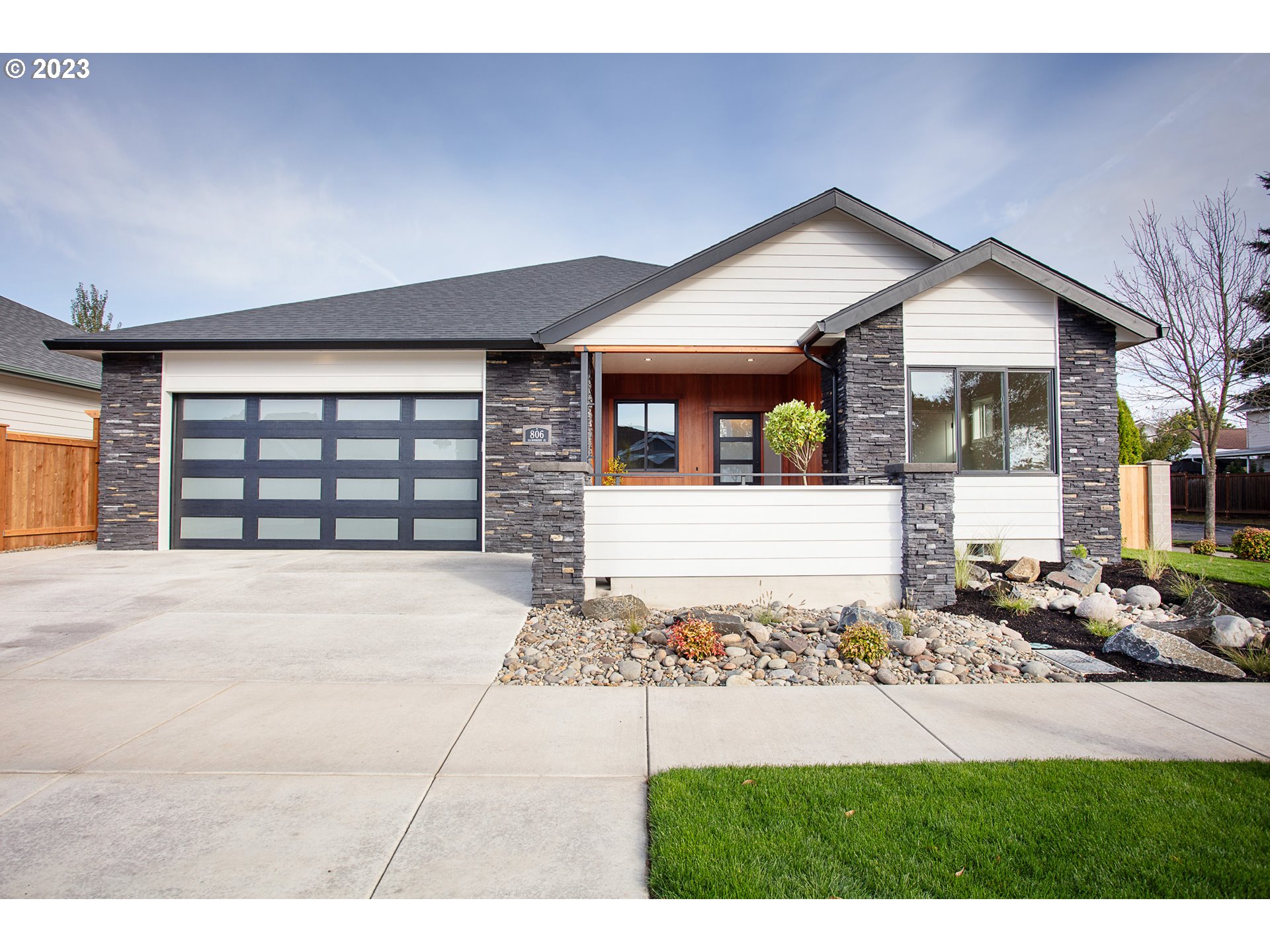 806 Salmonberry Street Springfield, OR 97477 - Photo 2 of 31 a front view of a house with a yard and garage