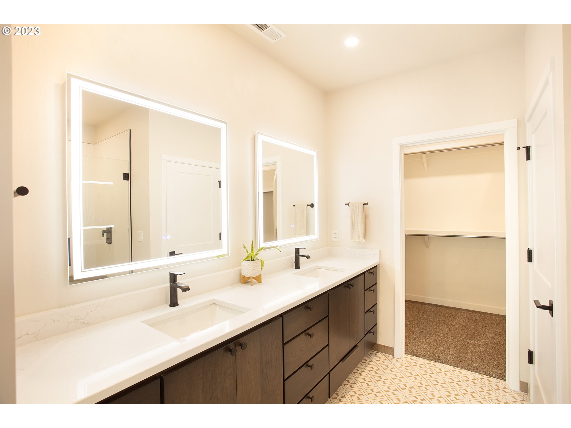 806 Salmonberry Street Springfield, OR 97477 - Photo 21 of 31 a bathroom with a sink double vanity and a mirror
