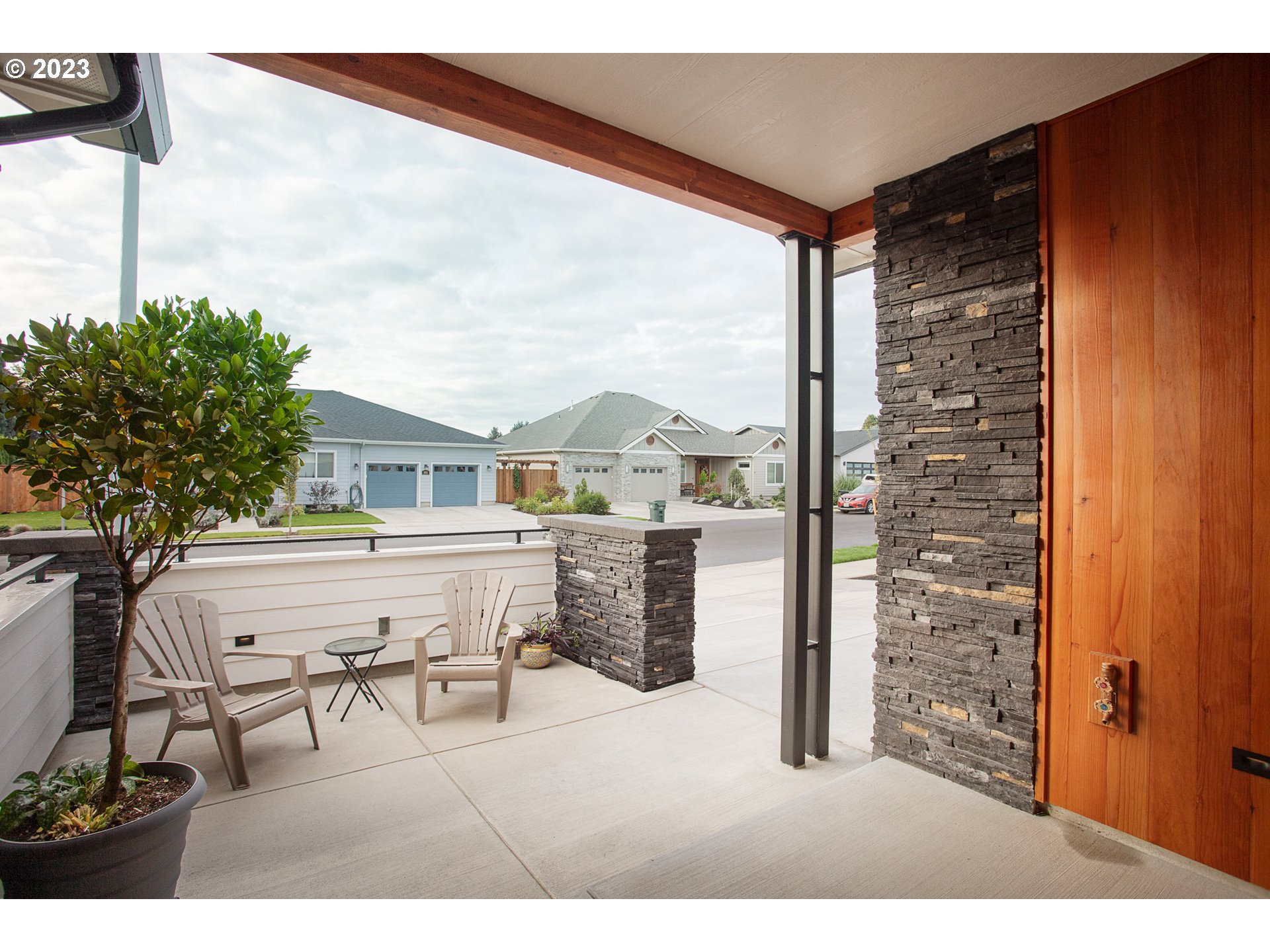 806 Salmonberry Street Springfield, OR 97477 - Photo 3 of 31 a view of a patio with table and chairs and potted plants