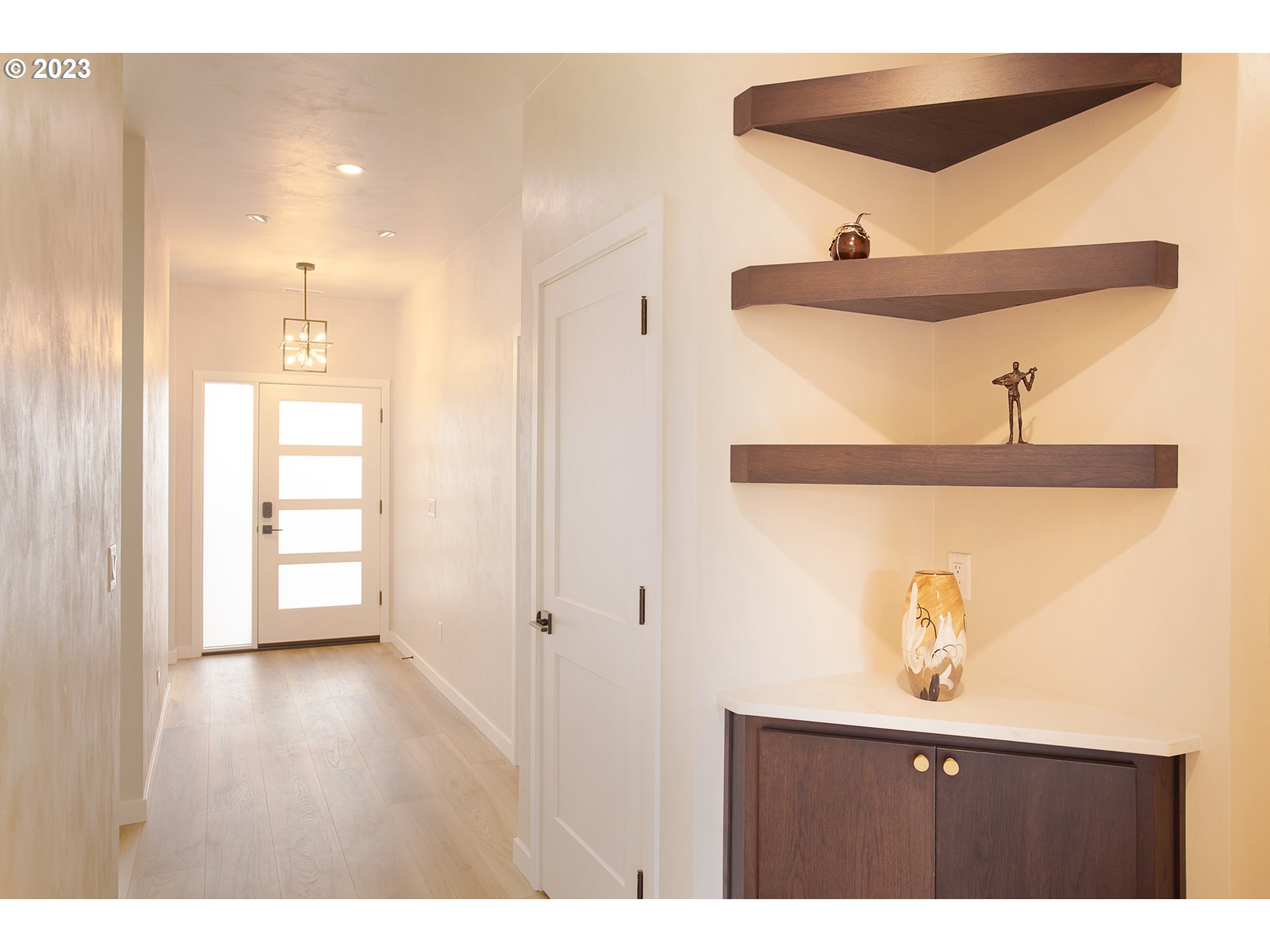 806 Salmonberry Street Springfield, OR 97477 - Photo 5 of 31 a view of a hallway to a bedroom with wooden floor