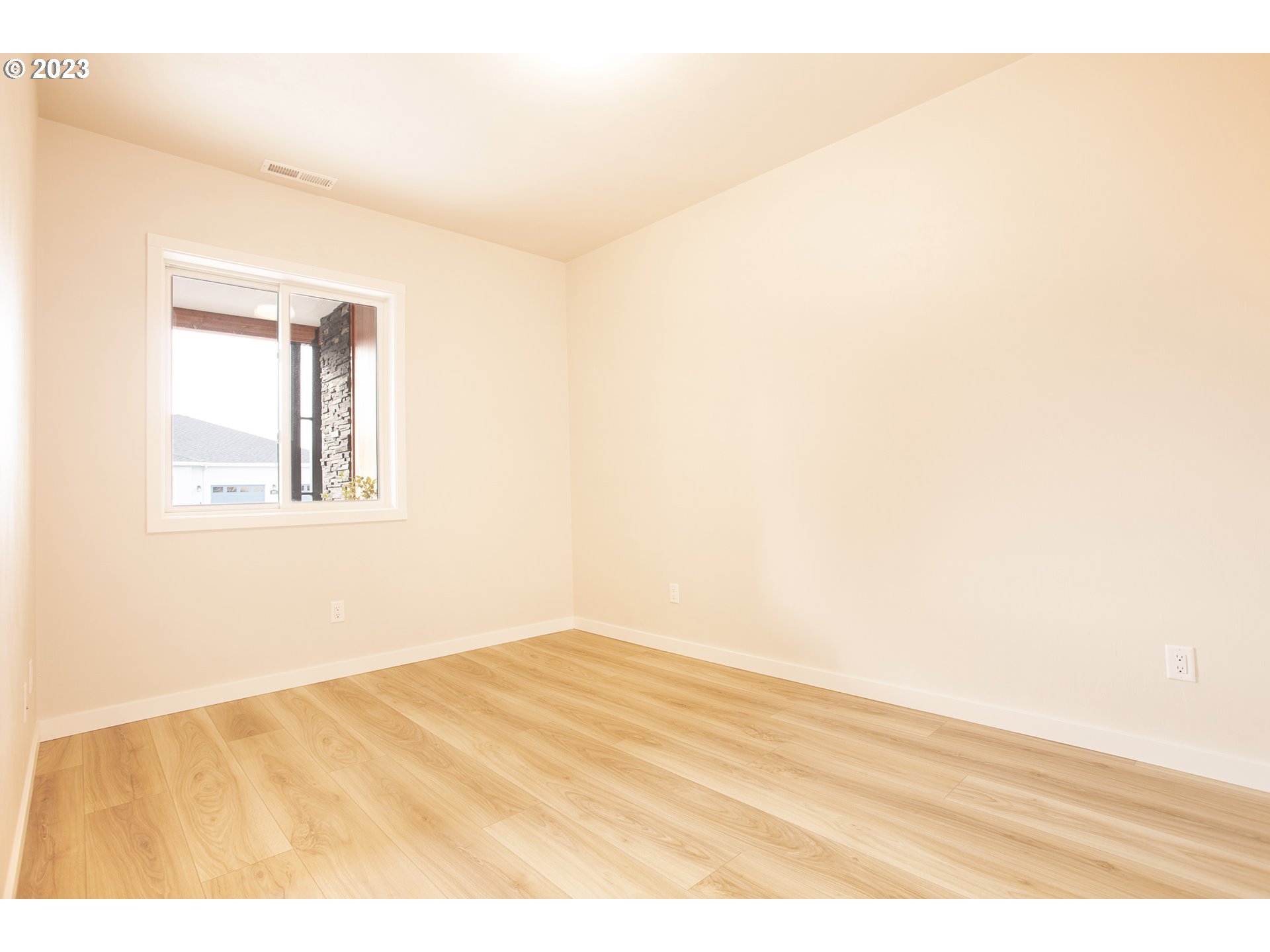 806 Salmonberry Street Springfield, OR 97477 - Photo 10 of 31 a view of empty room with wooden floor