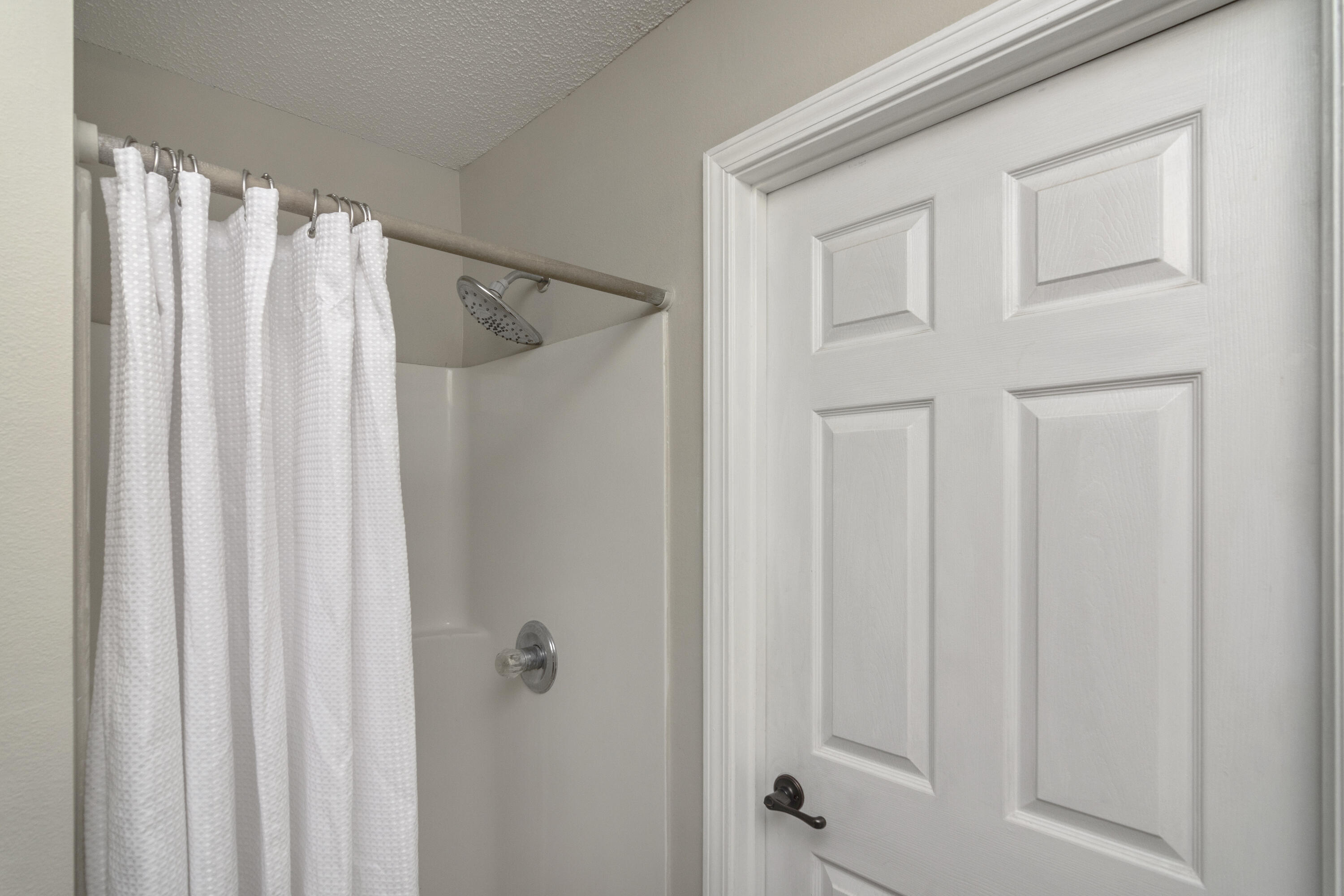 384 John King Road Crestview, FL 32539 - Photo 11 of 21 a view of a bathroom with a shower curtain