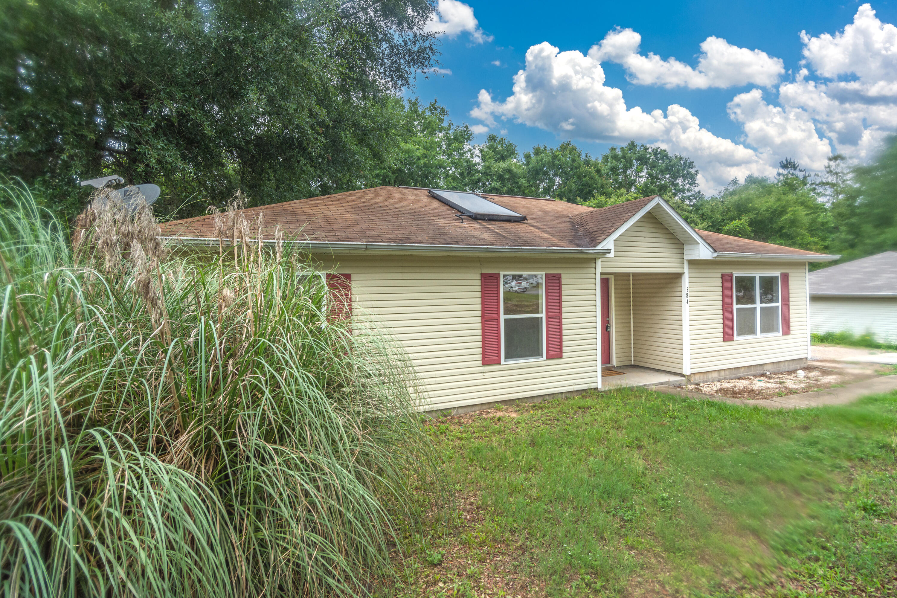 384 John King Road Crestview, FL 32539 - Photo 21 of 21 a front view of a house with garden