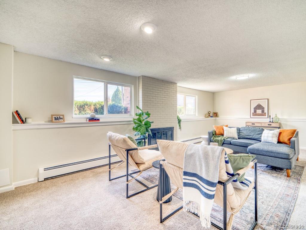 2730 West Mississippi Avenue, Unit 8 Denver, CO 80219 - Photo 18 of 40 a living room with furniture and a window