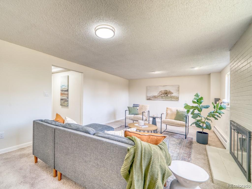 2730 West Mississippi Avenue, Unit 8 Denver, CO 80219 - Photo 20 of 40 a living room with furniture and a wooden floor