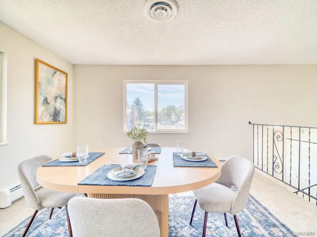 a dining room with furniture and window