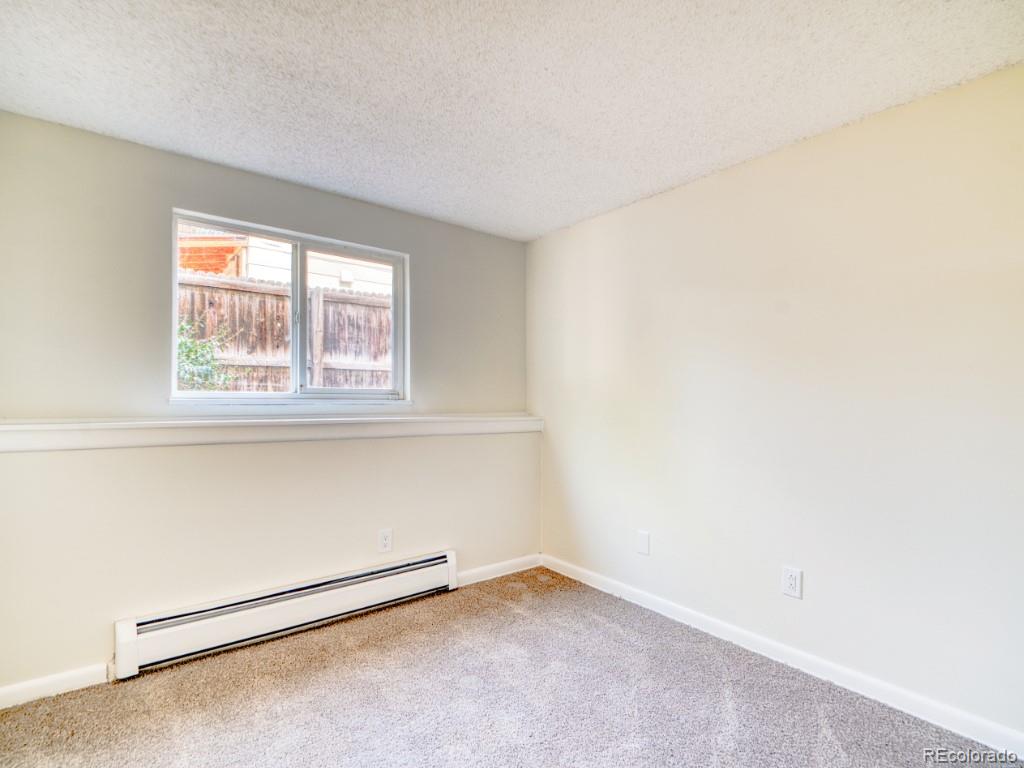2730 West Mississippi Avenue, Unit 8 Denver, CO 80219 - Photo 29 of 40 an empty room with a window