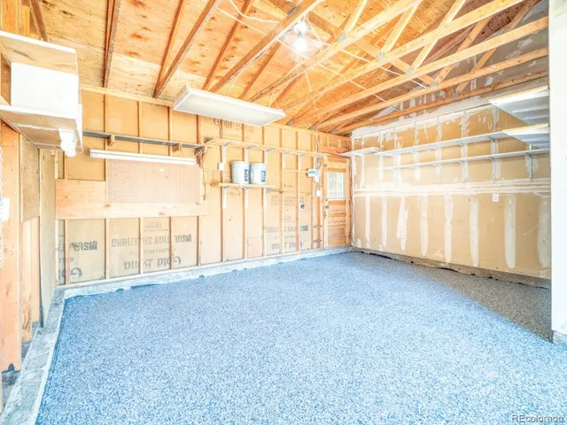 a view of a room with wooden walls