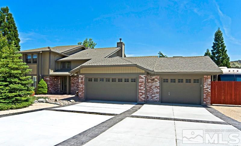 a front view of a house with a garage