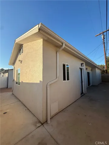 a back view of a house with a garage