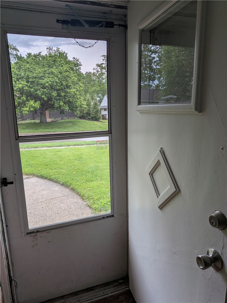 840 Brookfield Road Kettering, OH 45429 - Photo 4 of 13 Welcome guests to this charming home, offering a glimpse of the lush green surroundings.