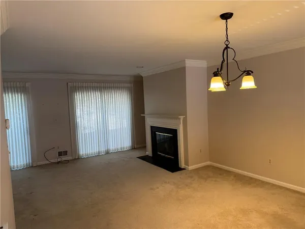 a view of a room window and fire place