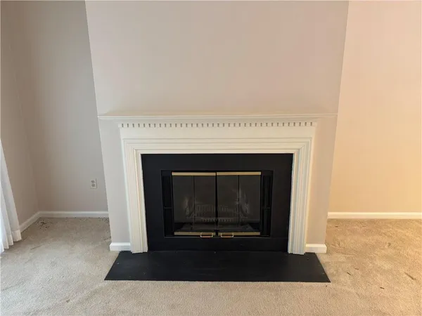 a living room with a fireplace