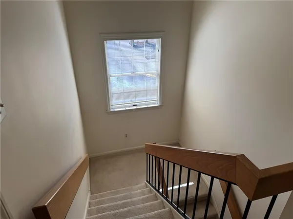 a view of a hallway with a window