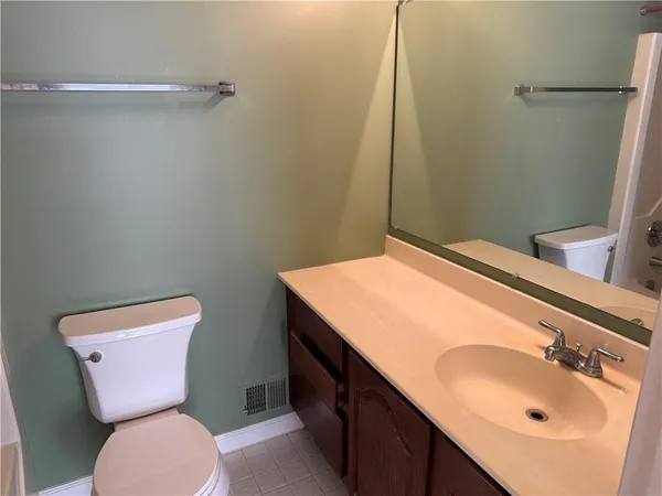 a bathroom with a sink and a toilet