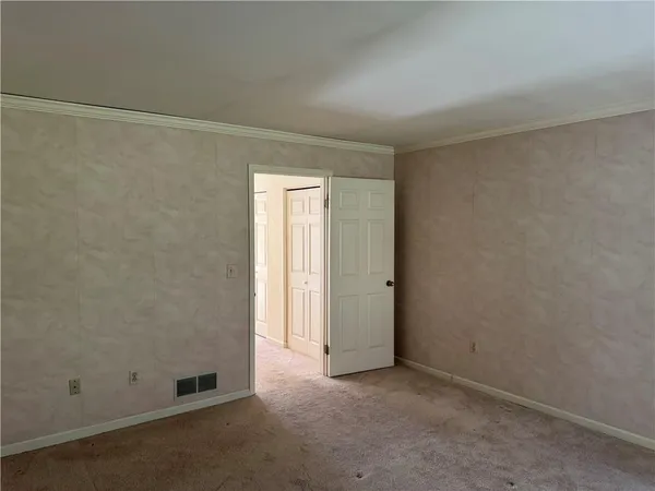 an empty room with a empty space and a window