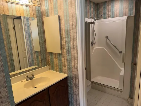 a view of staircase with white walls