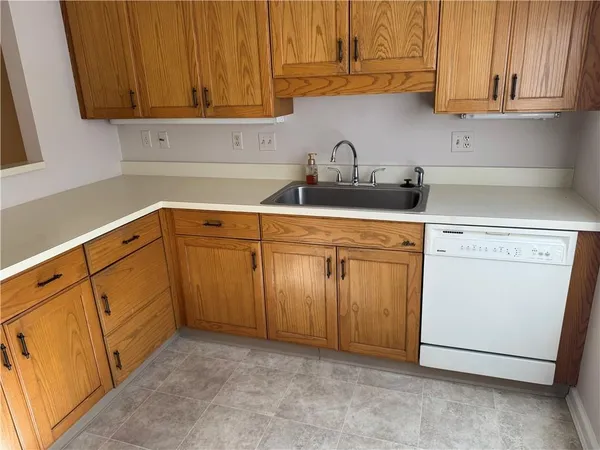 a kitchen with white cabinets
