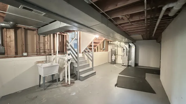 a view of an empty room with stairs